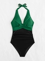 Detail of emerald green and black halter swimsuit with ruching and bow tie - Dark Green with Black