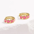 Close-up of gold hoop earrings featuring a row of small pink enamel hearts on stone surface - Heart Pink
