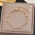 Close-up of double-layered gold stainless steel snake chain bracelet with cube charms - Gold Double Layer Cube Style (5128)