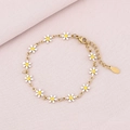 Close-up of a gold daisy petal bracelet with white enamel charms and lobster clasp detail - White (Gold)