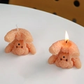 Pink bubble bear scented candle variant with creative textured finish and warm flame glow - Caramel color