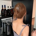 Detail of silver butterfly metal hair claw clip worn on a high-volume bun in Y2K style - Silver Shiny Butterfly Style (FJ3578)