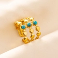 Detailed macro view of triple-row gold beaded ring with three turquoise stones - Triple Layer Beaded / Gold Dark Blue Gem