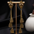 Close-up of vintage gold tassel earrings with white rhinestones on black satin stand - H4183-1 Antique Gold