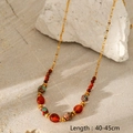 Detail of multi-layered stone beads on a gold-plated stainless steel chain necklace - LC40023 Ethnic Red Agate Stone Necklace