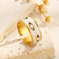 Detail of gold evil eye ring with white enamel on a natural textured stone base - White Enamel Eyelash Eye Style (A-806)