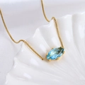 Marquise cut light blue crystal pendant necklace on gold box chain in shell dish - Aries