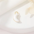 DIY golden crescent moon pendant with white enamel on elegant textured fabric background - White Shell Moon
