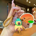 Portachiavi in peluche capibara con cappello a rana e cordino intrecciato marrone - Modello Dinosauro