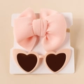 Flat lay of soft pink bow nylon headband and heart-shaped sunglasses for baby girls - Light Pink Set