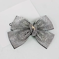 Close-up of sparkling silver rhinestone bow hair clip with high quality crystal detail - 9.5cm Cross White Rhinestone