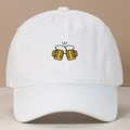 Detail of beer mugs embroidery on the front of a white washed cotton baseball cap - Adjustable / White
