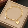 Elegant gold heart pendant necklace with pearl charm displayed in a beige jewelry box - 2# Bracelet (N1079)