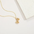 Gold-plated 14K bow pendant necklace with zircon stones on white stone stand - Full Zircon Bowknot