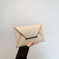 Elegant cream textured envelope clutch bag with gold metallic trim and closure - Beige