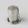 Detailed view of SUS304 stainless steel tea infuser with mesh and chain on holder - Small Machined Honeycomb Style + Base