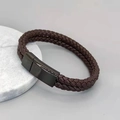 Macro view of double-layer braided brown leather bracelet with black magnetic clasp - Black Clasp Brown Leather