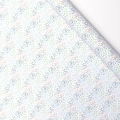 White gift wrapping paper with colorful pastel polka dots in a diagonal pattern - Jungle Polka Dots