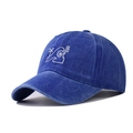 Detailed macro view of a blue washed distressed baseball cap featuring white wave embroidery - Adjustable / Sapphire Blue