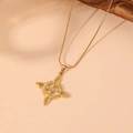 Detail of gold Celtic knot pendant with center gemstone on a delicate snake chain - Gold Style 6 (C418)