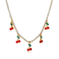 Detailed view of gold tennis necklace featuring red and green crystal cherry pendants - Gold Rhinestone Cherry Necklace (12402)