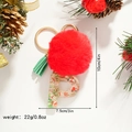 Detail view of resin letter P keychain with red pompom and festive snowman sequins inside - Letter P