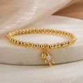 Goldenes Perlenarmband mit süßem Bärenanhänger und Zirkon auf Marmorsteinplatte - 31552-Gold Weißer Zirkonia