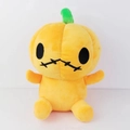 Detail view of a plush Halloween pumpkin with soft orange fabric and green stem - 25cm / Orange