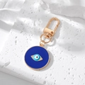 Close-up of golden spring hook with blue enamel evil eye charm on white stone - 2# Dark Blue Round Eye