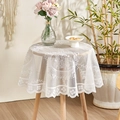 Elegant white round lace tablecloth with hollow patterns on a cozy wooden cafe table - New White Round Mirror Flower