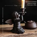 Europese vintage gietijzeren knielende engel kandelaar met vleugels in zwart metaal - Retro Gietijzeren Knielende Engel Kandelaar 8526