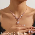 Detail of rose gold bridal jewelry set featuring teardrop pendant necklace and stud earrings - GS01 Waterdrop Set / Rose Gold