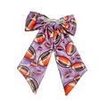Detail of purple rugby bow hair clip showing fabric texture and metal fastener - Purple Football