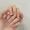 Short almond press-on nails featuring pastel macaron french tips on model hands - R831 Rainbow French Style / Nail Glue Version