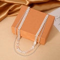 Silver double-layered choker with chevron charms and thin chain on orange gift box - Silver