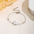 Elegant butterfly charm bracelet in silver finish with white shell inlay and zircons - Butterfly Bracelet (7989)