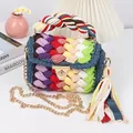 Detail of a handmade rainbow crochet crossbody bag with a gold twist lock and chain strap - Fruit Green