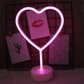 Pink heart-shaped LED neon light with white base on decorative grid background - Pink Heart