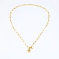 Close-up of golden paperclip chain bracelet with a 3D solid heart pendant and clasp - Necklace / Gold