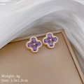 Detail of clover earrings with purple stone and micro-set zircons on white silk - Purple Clover Stud Earrings (J326)