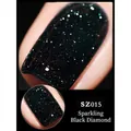 Close-up of glitter nail polish in shade SZ015 sparkling black with teal diamond effect - 8ml / Shining Black SZ15