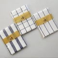 Detail showing blue and white waffle weave kitchen towels in retail packaging - Plaid 3-Piece Set / 45*65cm