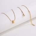 Detailed macro of golden snake chain necklace with lobster clasp and extension link - Gold Airplane Necklace