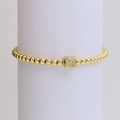 18k gold beaded elastic bracelet featuring a sparkling cubic letter R charm - Letter R