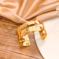 Fashionable gold cuff bracelet with artistic hammered texture and wavy pattern design - Gold Wave Hammered