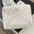 Detailed view of quilted cotton makeup bag featuring cherry prints and fine stitching - Clutch Bag / White with Cherries
