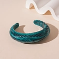 Close-up of a dark green acrylic cuff bracelet with spiral texture and marble pattern - Green Cross Threaded Open Style (55#)