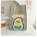 Knit tote bag featuring black and white stripes with a yellow flower pattern - Floral Yellow