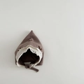 Detailed macro view of baby knit bonnet with white lace trim, bow and pearl accents - 6-24 Months / Brown
