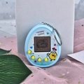 Light blue egg-shaped virtual pet keychain with four yellow buttons on a pink background - Chicken/Blue